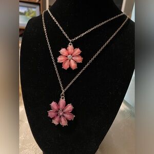 2 flower necklaces purple and pink